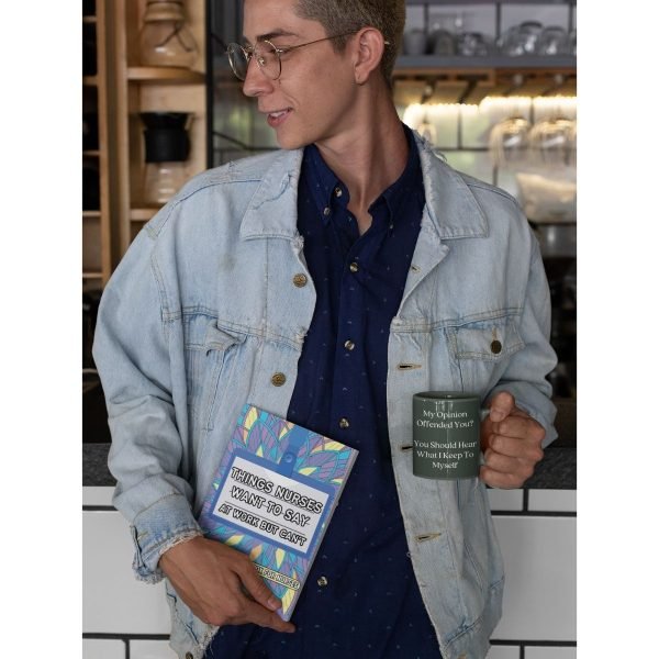 Man holding cup of coffee and funny coloring book for nurses